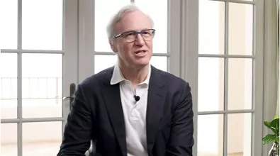 middle aged man with glasses in a suit