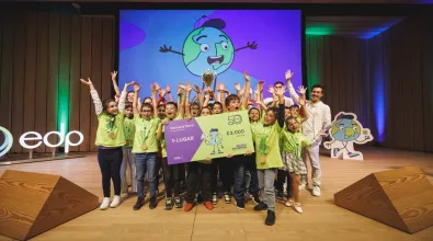 Group of kids  receiving a check as winners