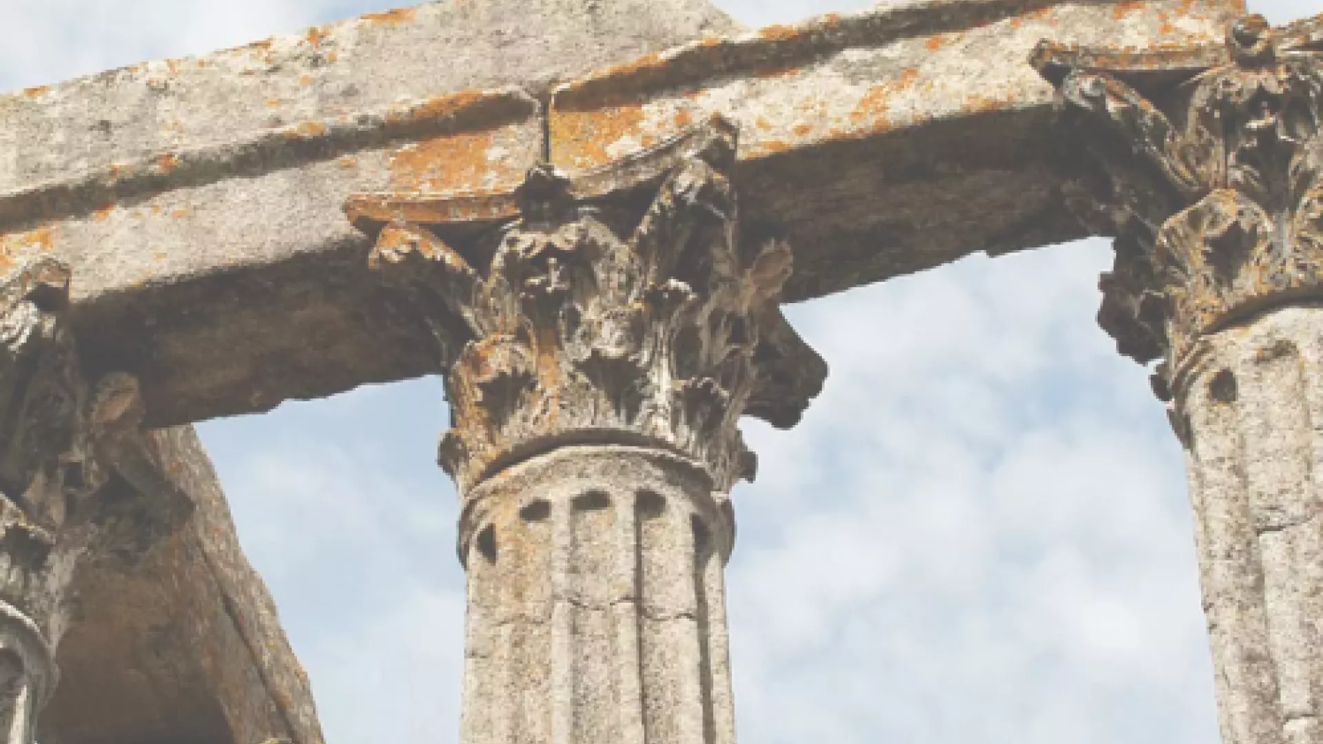 close-up of ancient roman columns with ornate capitals in evora, portugal