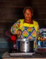 Woman stiring a pot on an smart cooktop